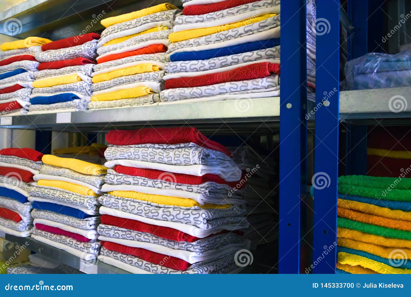 Towels, Bed Sheets and Clothes on the Shelf Stock Photo Image of