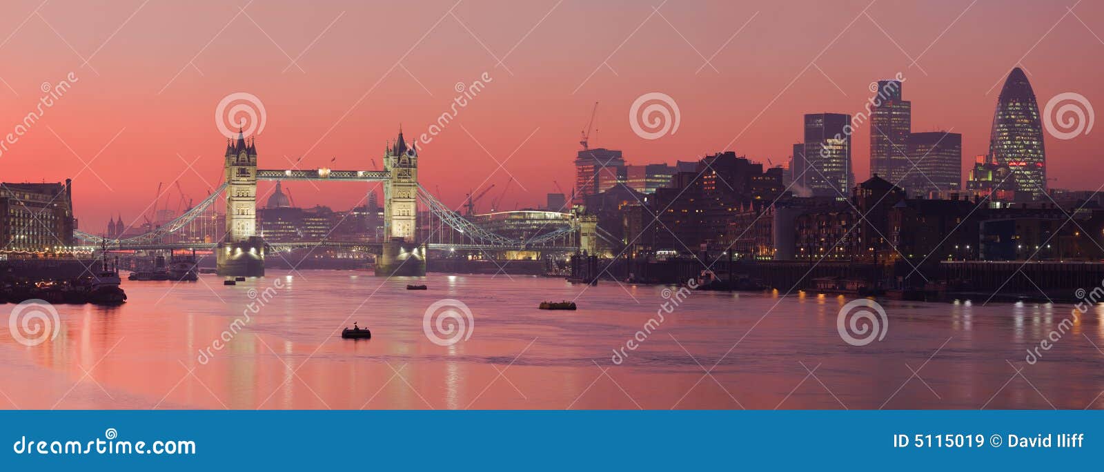 tower bridge and city of london with deep red suns