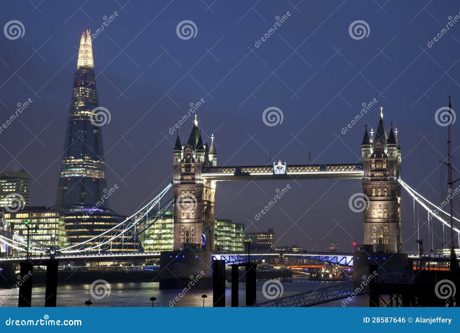 tower bridge and the shard in london at night