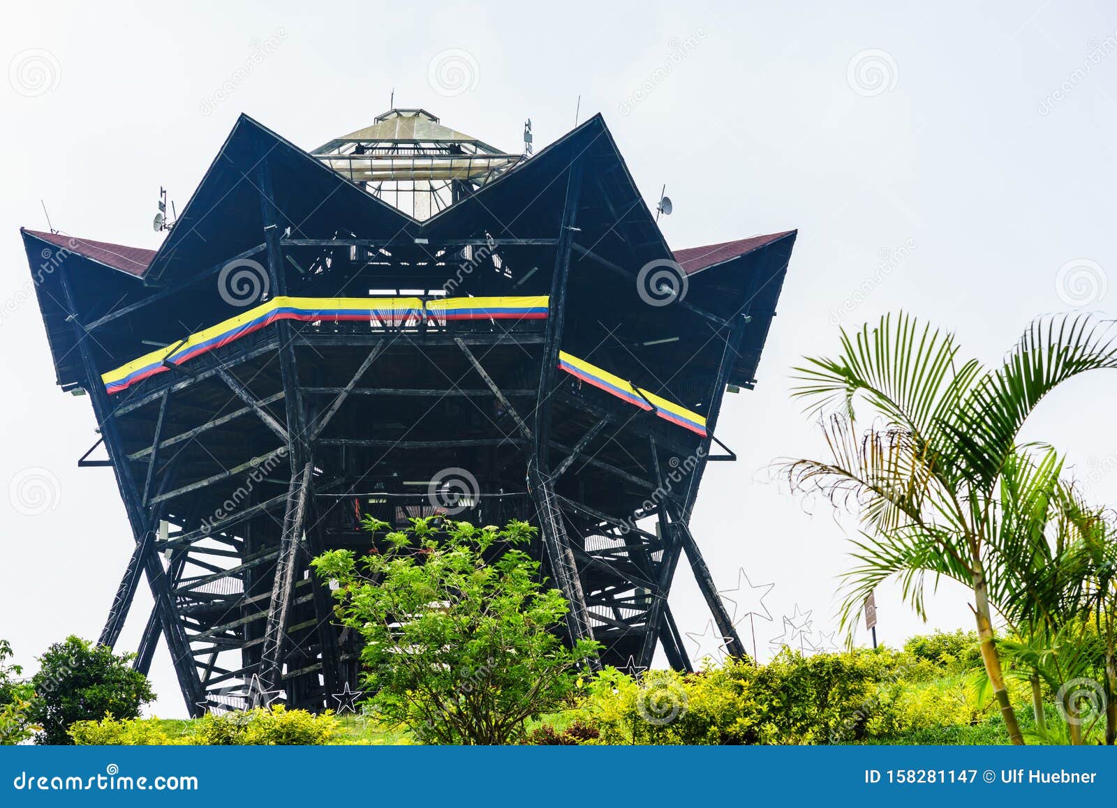 view on tower colina iluminada next to colonial village of filandia, colombia