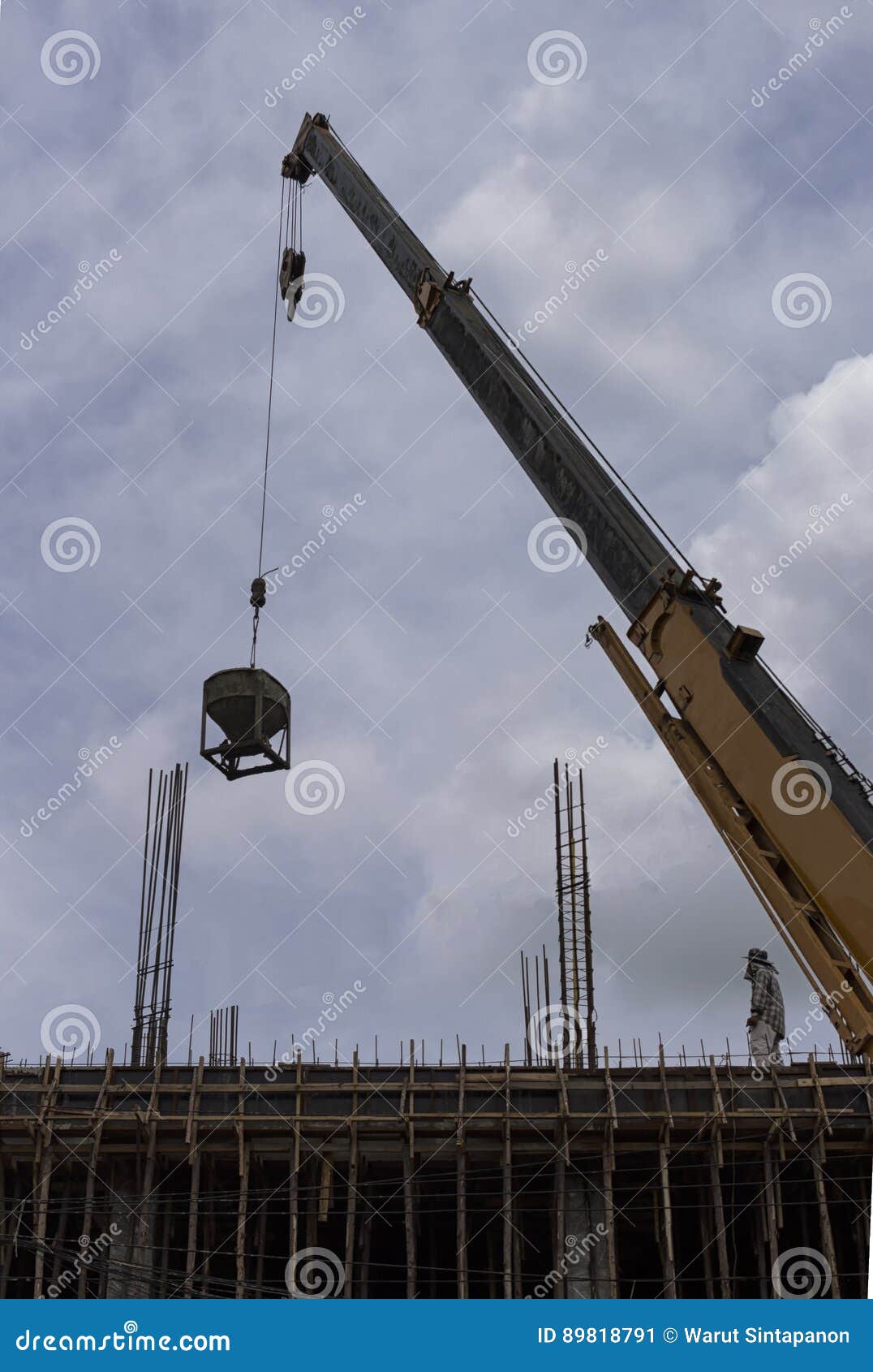 Tower crane lift cement bucket up to top of building