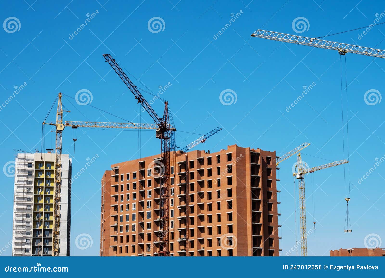 Tower Cranes Construction Site with Buildings Under Construction on