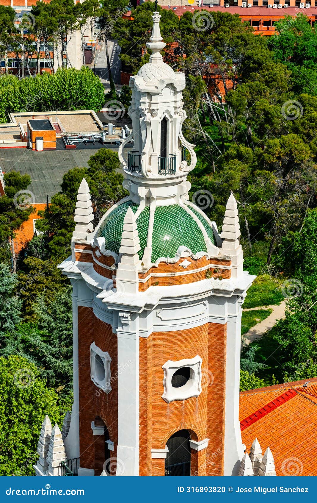 tower of an old church in the city of madrid next to the entrance of the moncloa to the city.