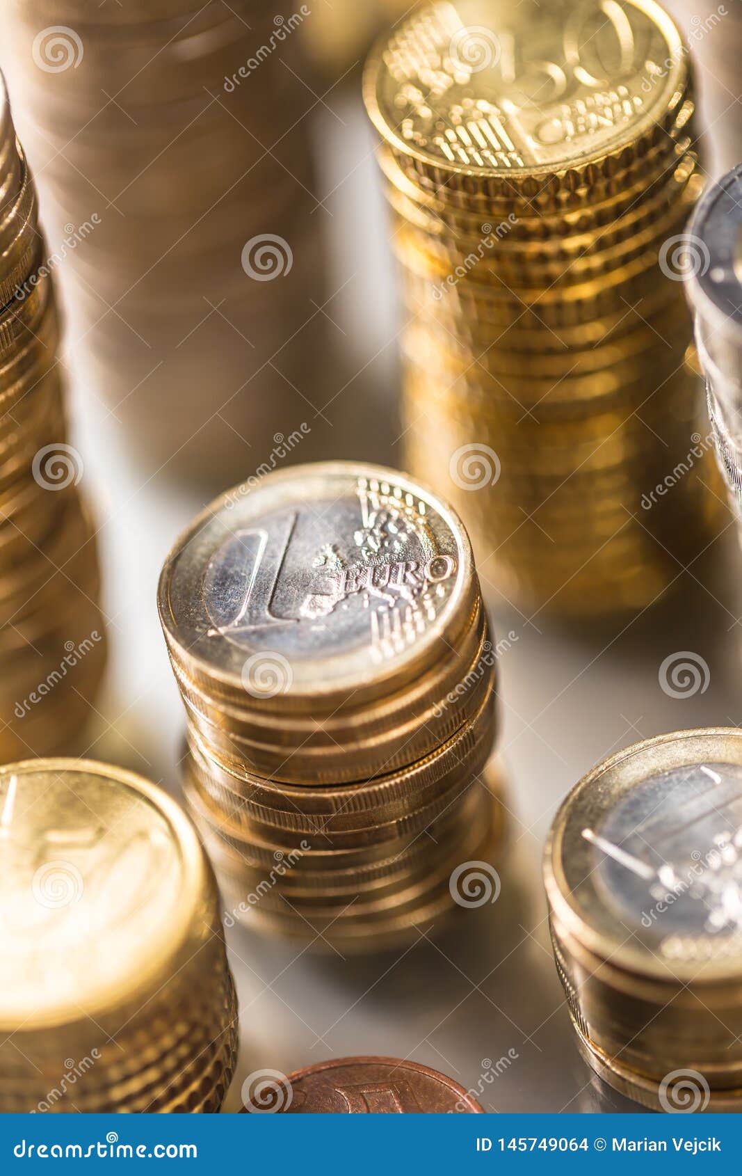 Towers of the euro coins stacked in different positions. Towers of the euro coins stacked in different positions