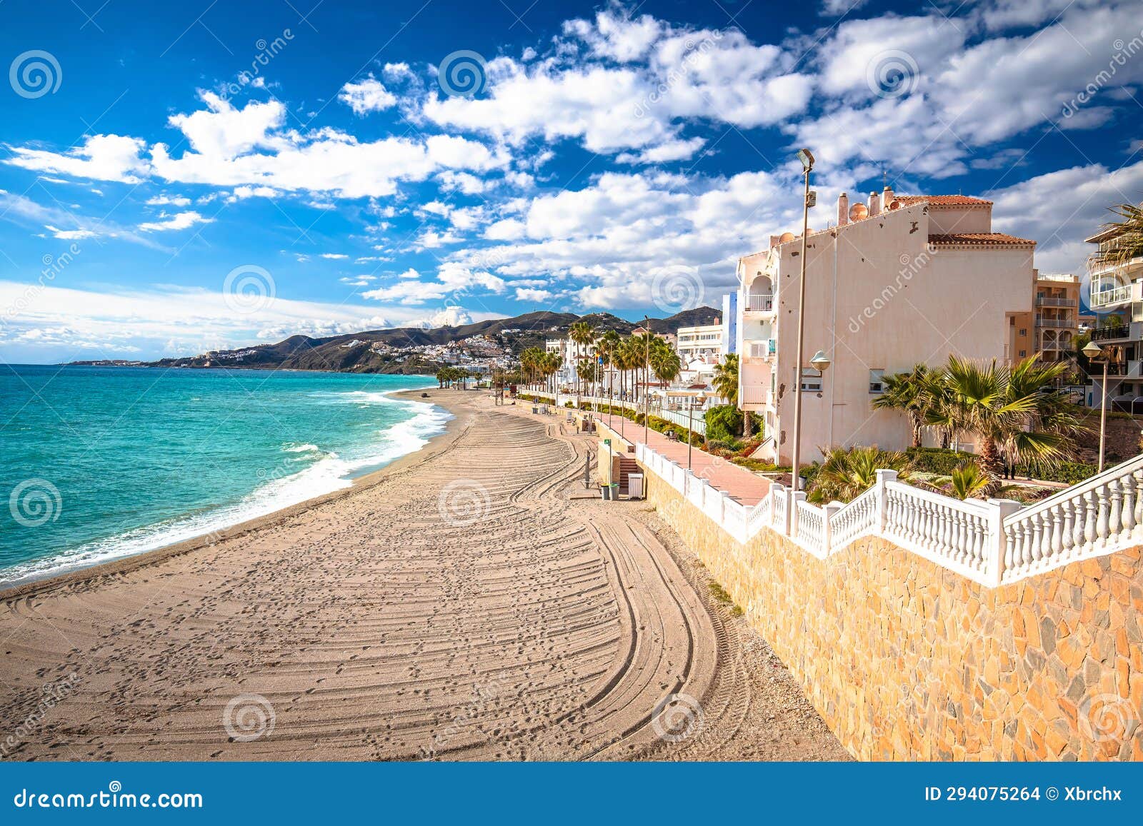 town of nerja turquoise sand beach view