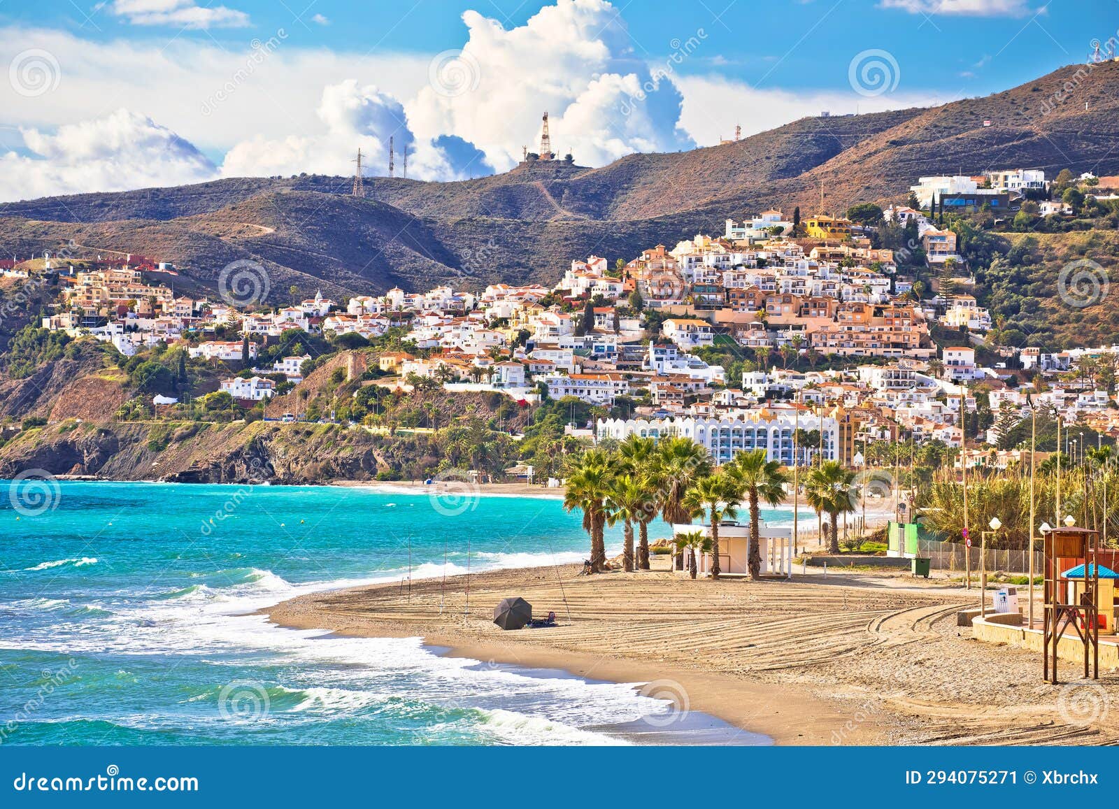 town of nerja turquoise sand beach view