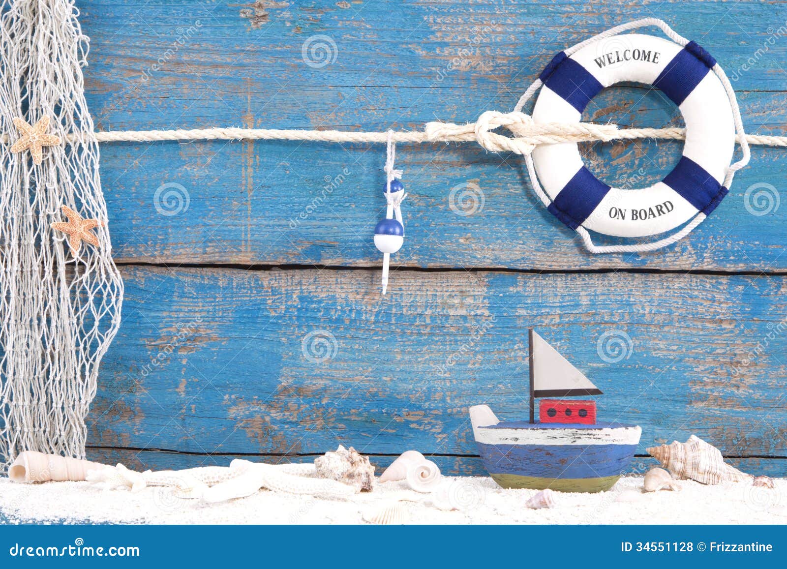 Toy Boat With Shells On A Blue Wooden Background For ...