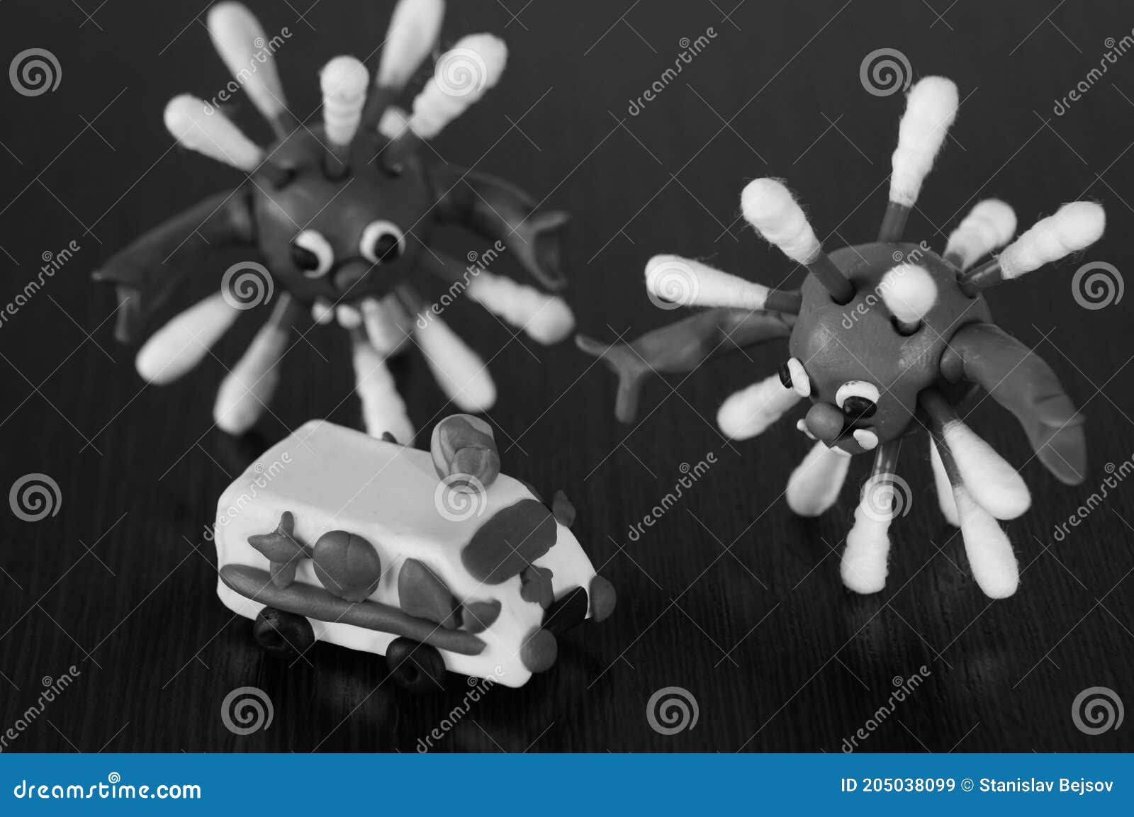 Toy Car Ambulance and the Figure of the Virus on the Table Stock Image