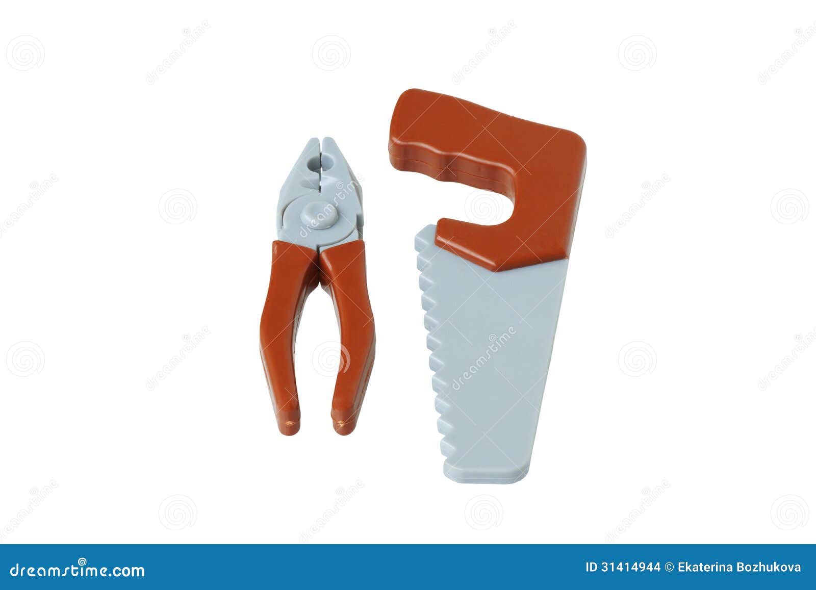 Toy Carpentry Tools. Pliers and a Saw Stock Photo Image of games