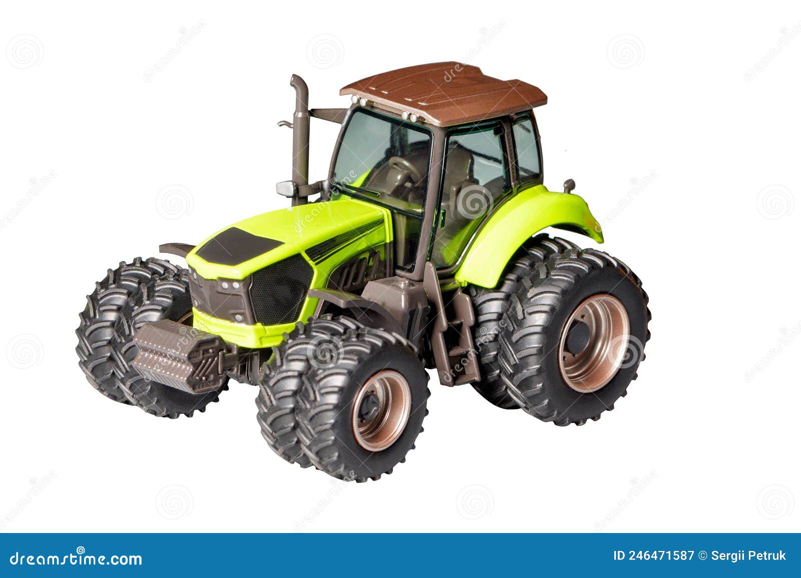 toy model of a powerful construction maneuverable tractor with wide wheels. the image is  on a white background