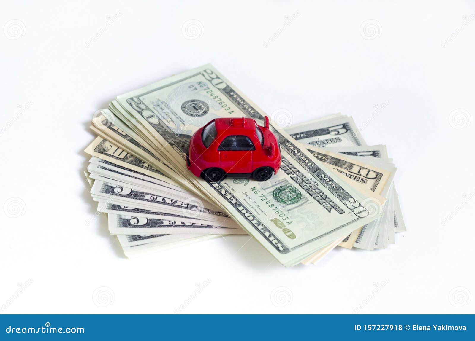 Toy Red Car and a Stack of Money Dollar Bills American Dollars on