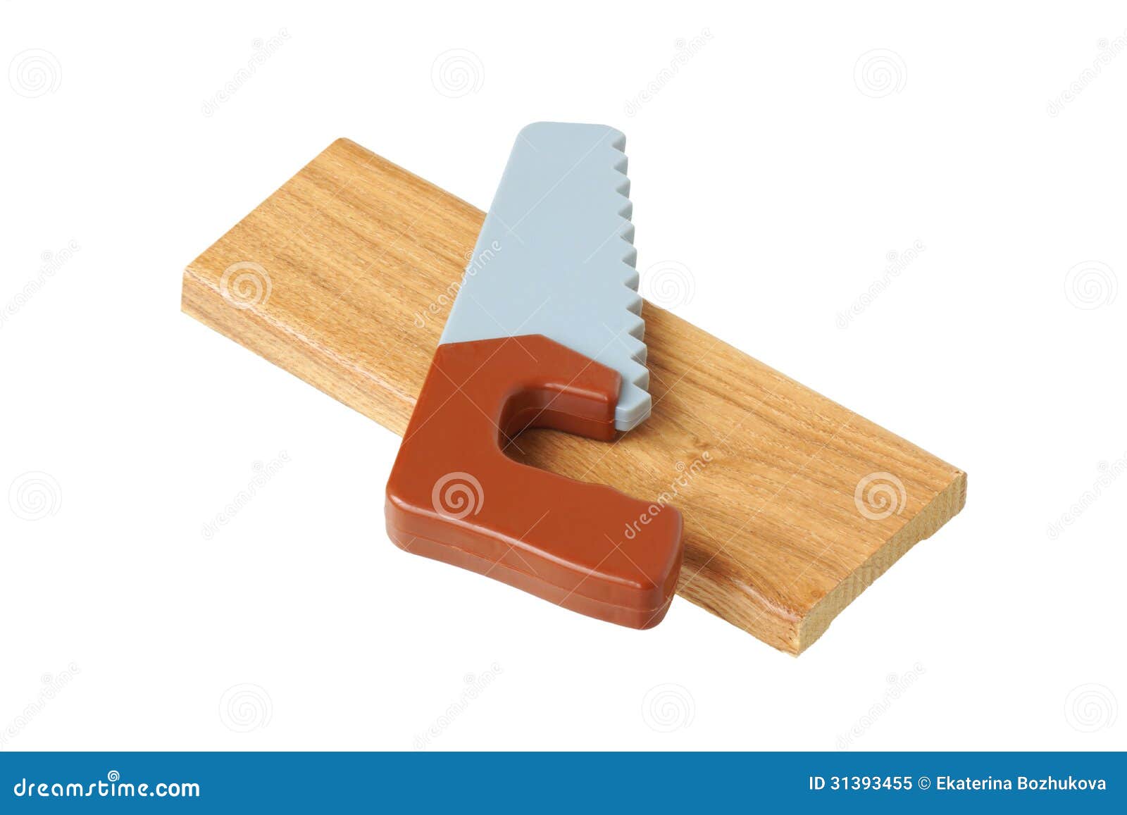 Toy saw on a piece of wood stock image. Image of cross ...