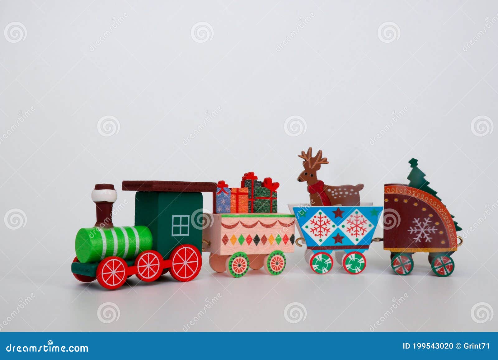 A Toy Wooden Christmas Train Carries the Attributes of Winter Holidays ...