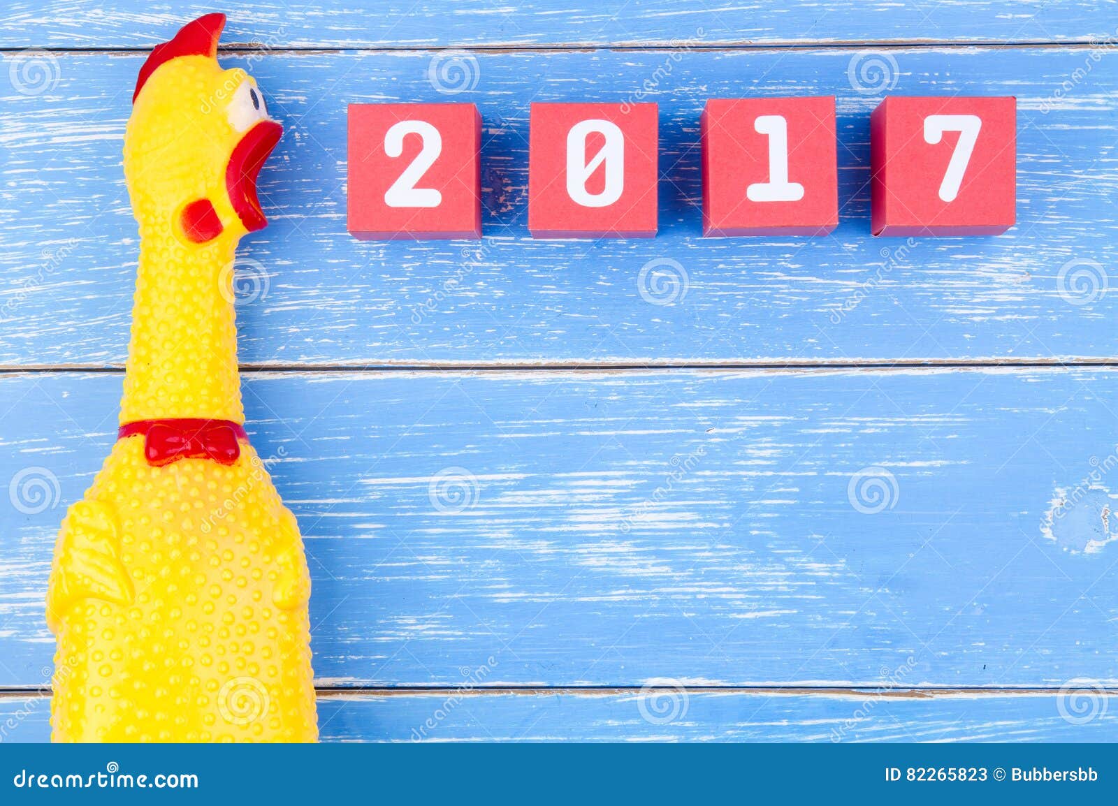 toy yellow shrilling chicken and happy new year 2017 number on r