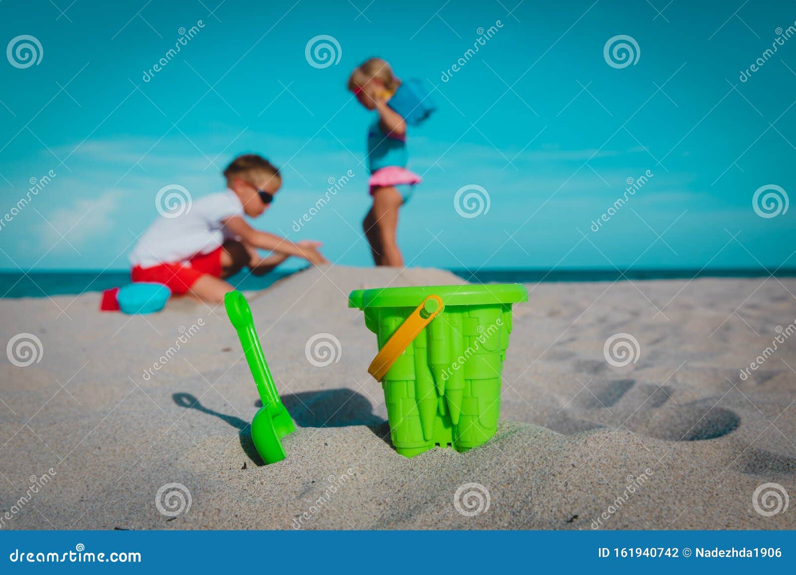 Toys and Kids Playing on the Beach Stock Photo - Image of children ...