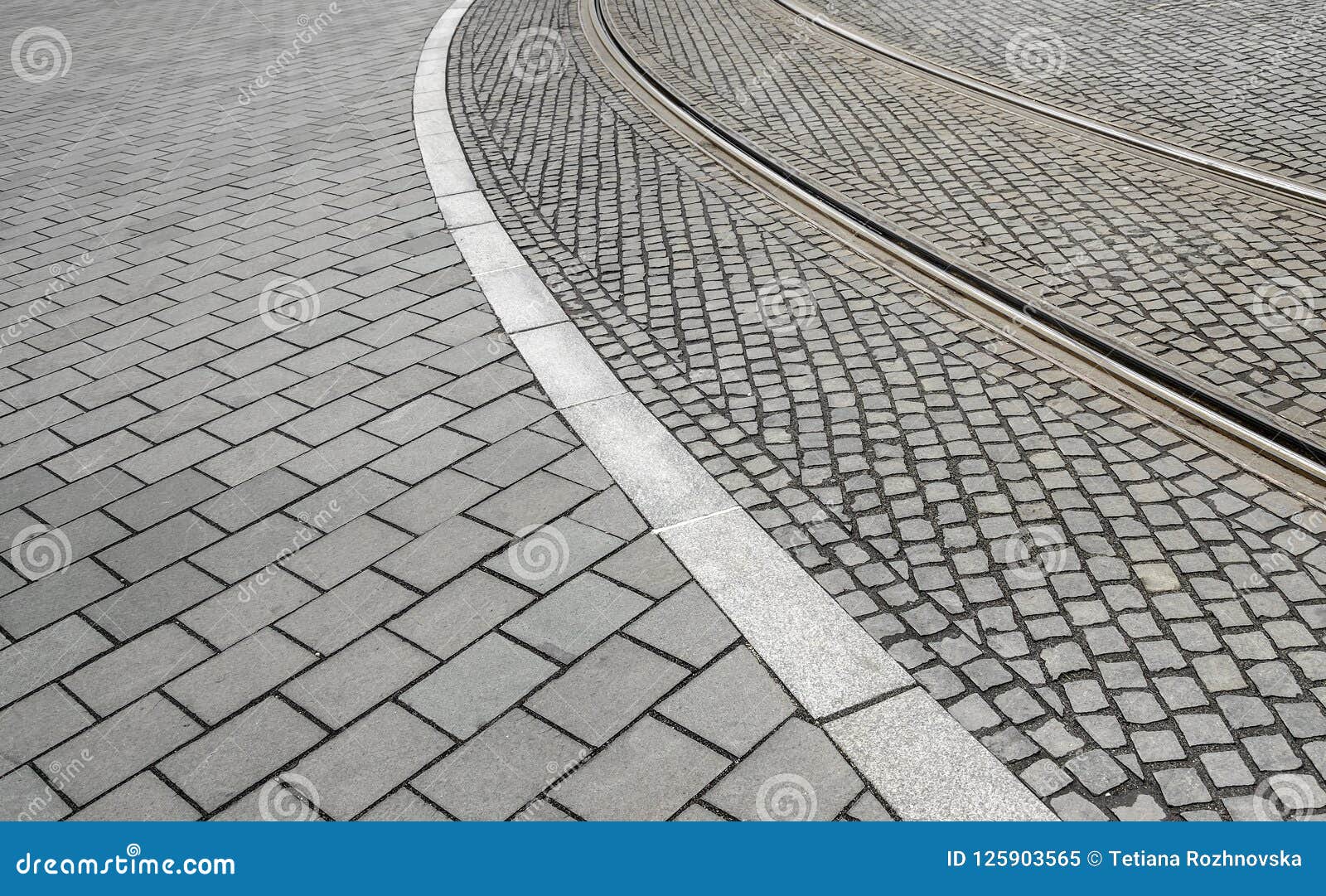 traces of tram tracks on the road.