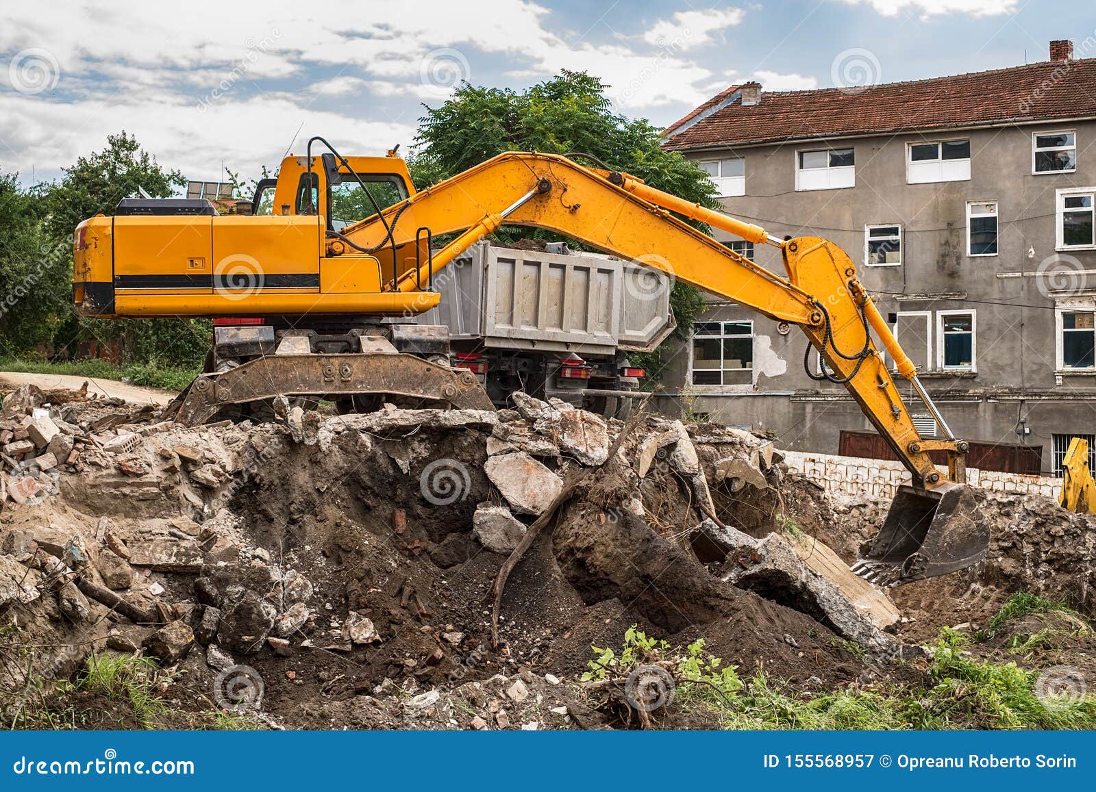 Tracked Excavator Loading the Material in a Truck Stock Image Image