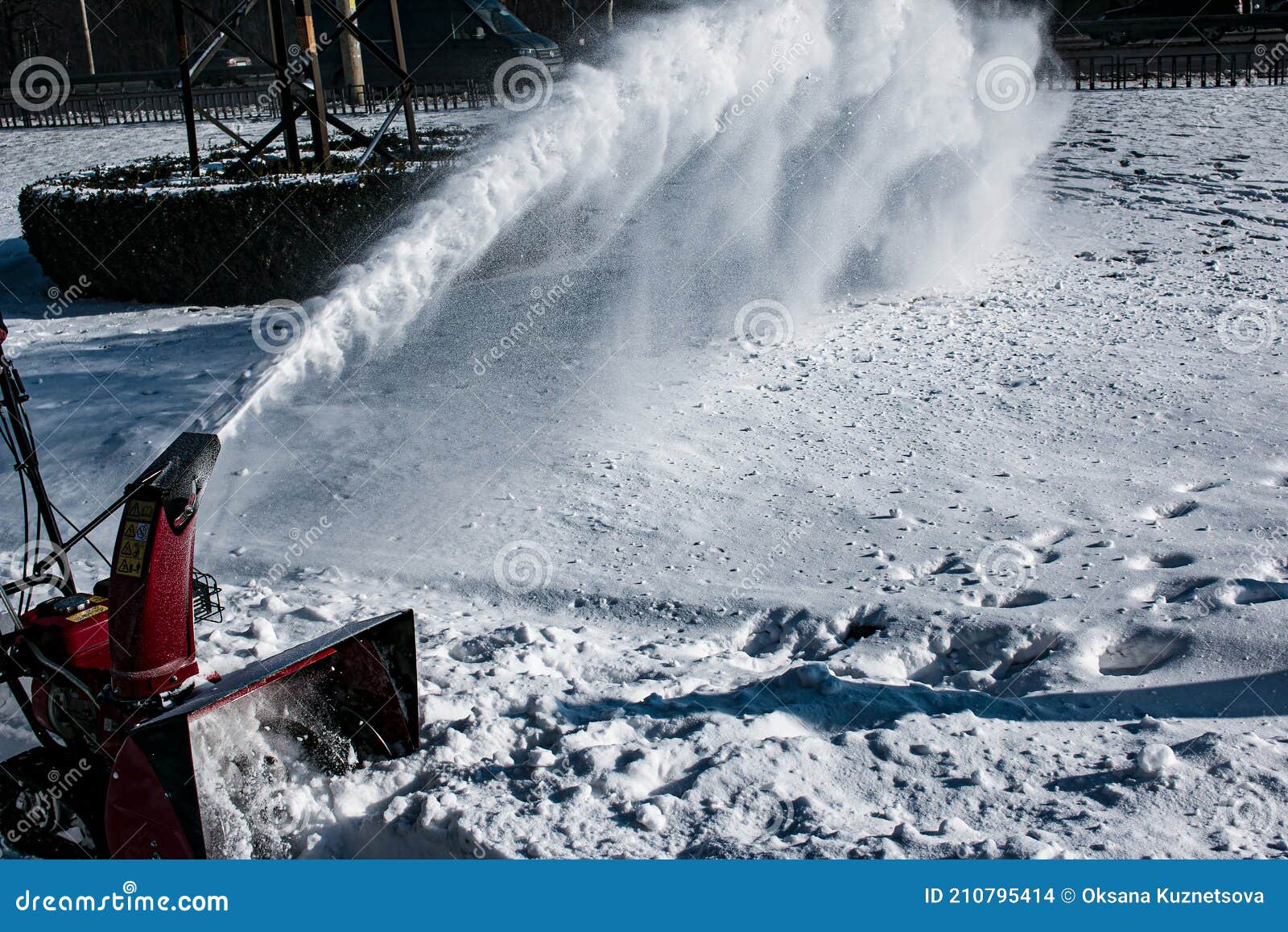 tracked snow blower at work.