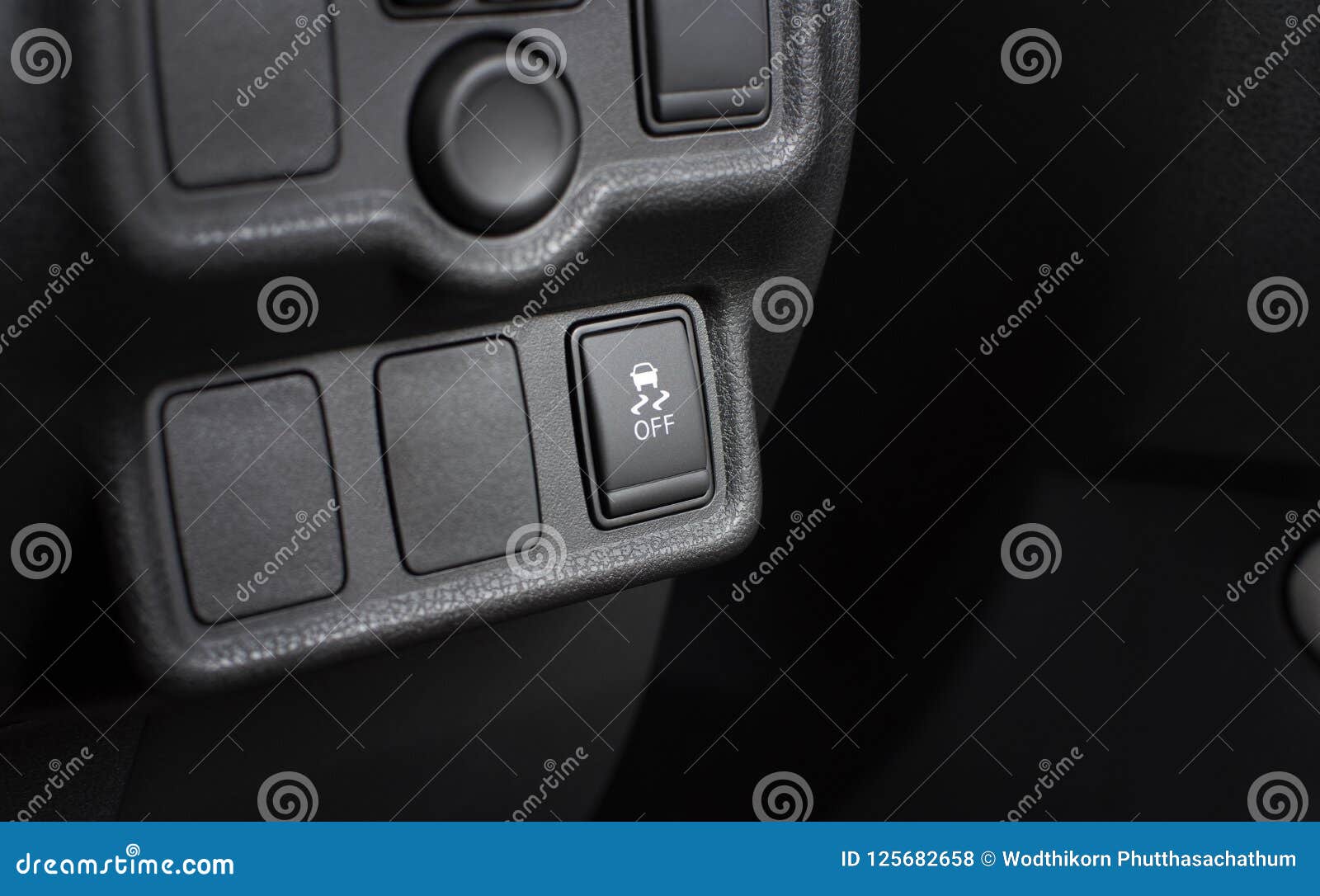 Traction Control Switch Button and Blank Socket in Car. Stock Photo