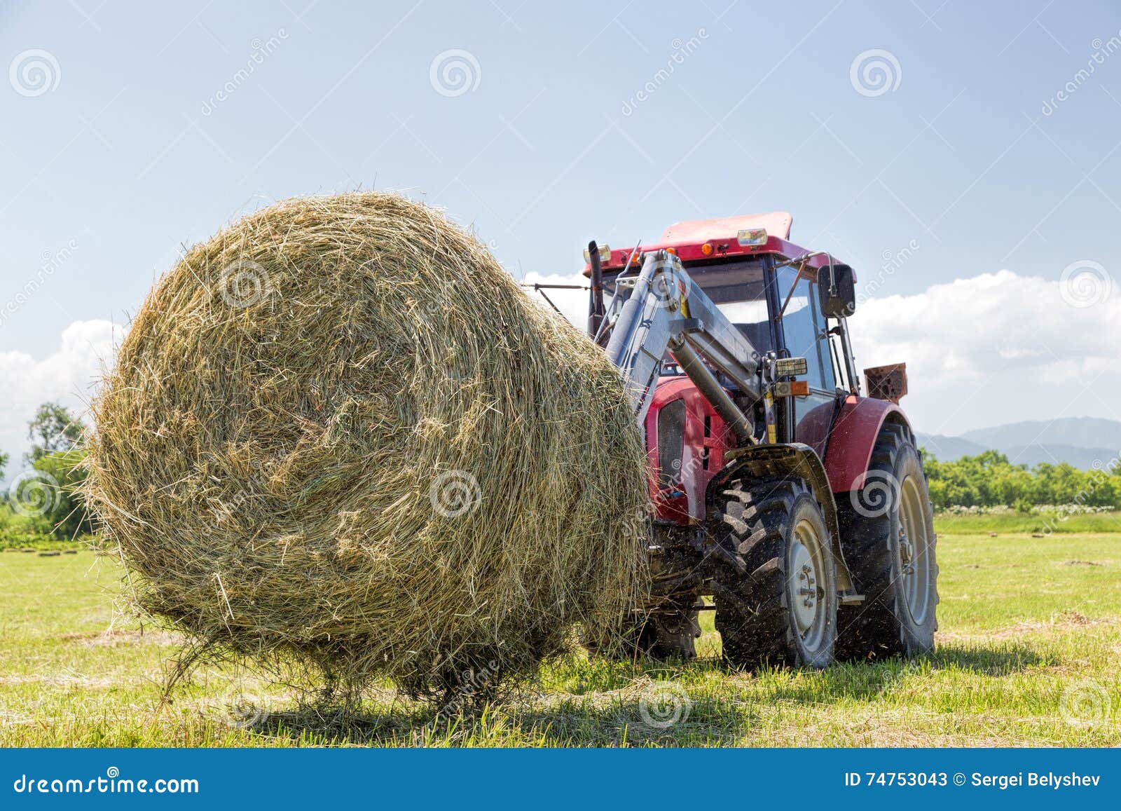 Tractor Collecting Straw Bales Stock Image Image of work, blue 74753043