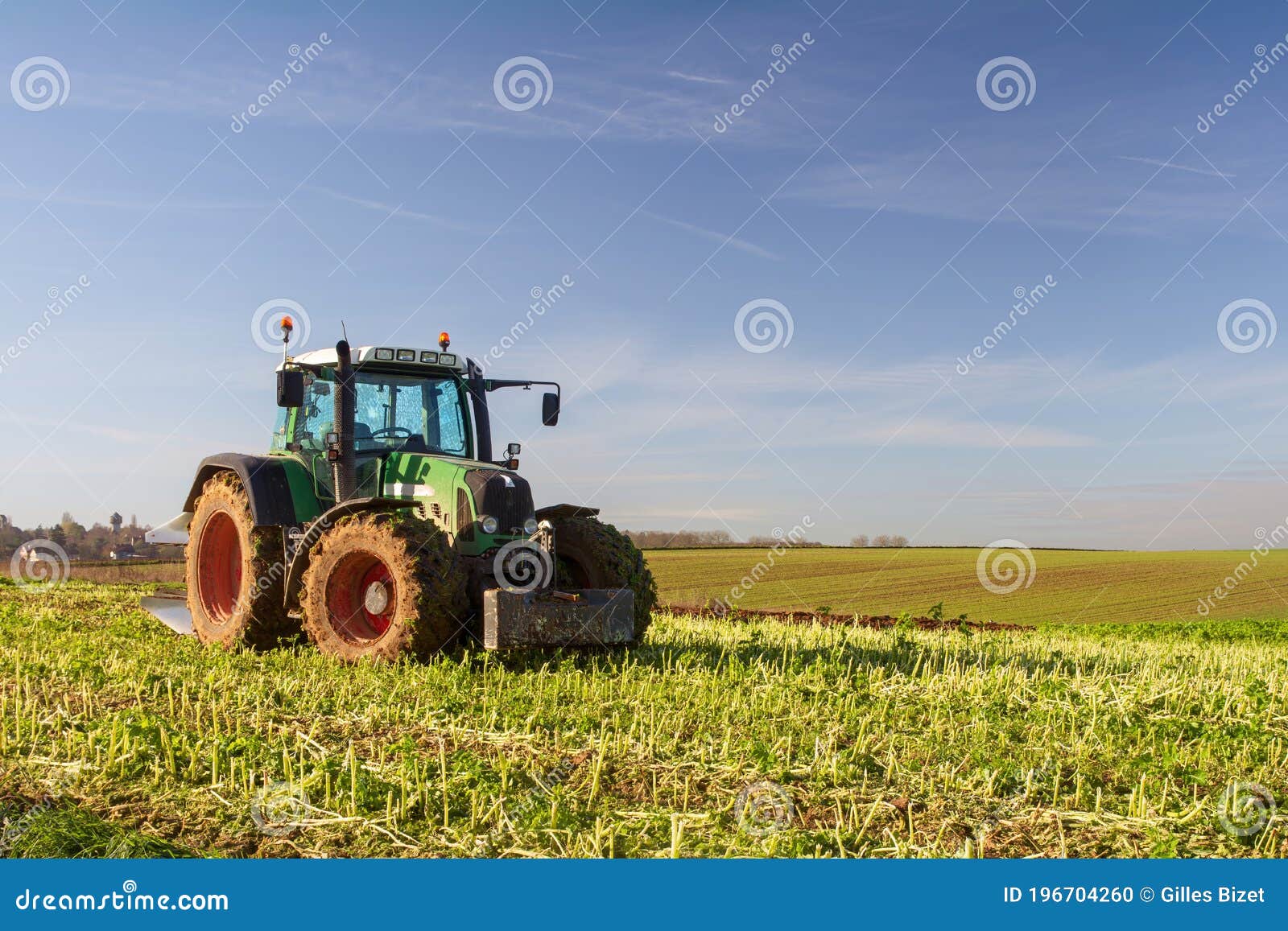 Tractor in the fields stock photo. Image of countryside 196704260