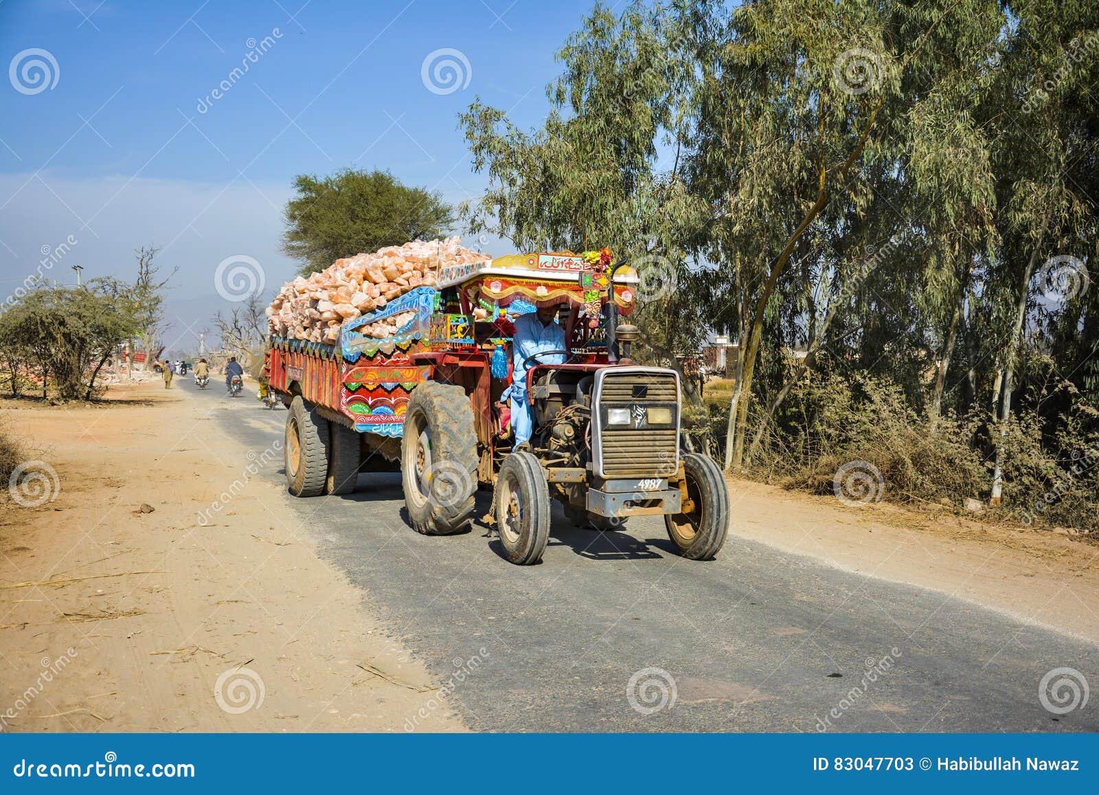 Rock Salt Farmer Scraping The Soil To Bring To Boil As Salt For