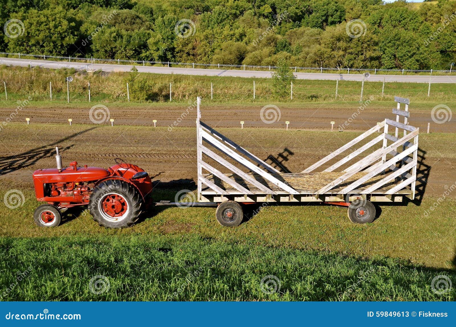 Tractor pulling hay rack editorial stock photo. Image of empty 59849613