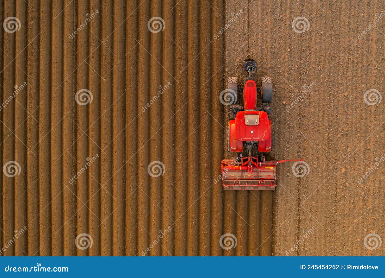 tractor pulls subsoiler to prepare beds for sowing grain