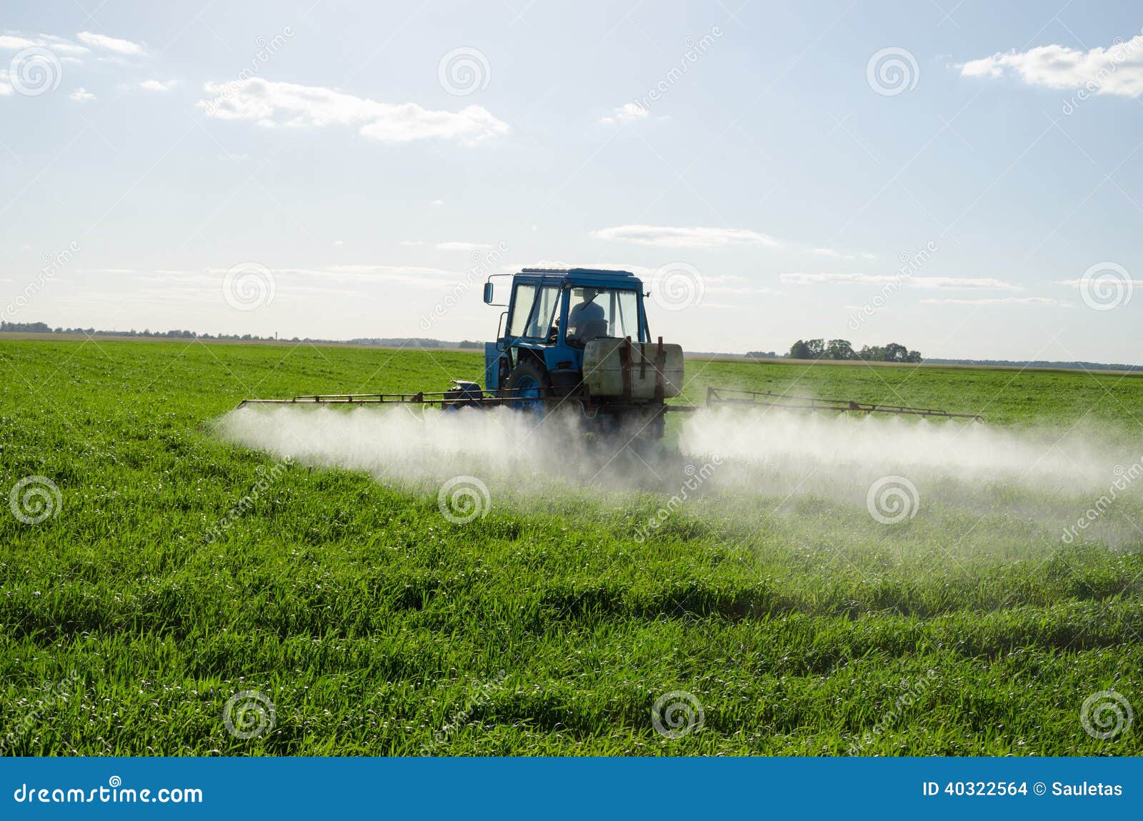 tractor spray fertilize field pesticide chemical
