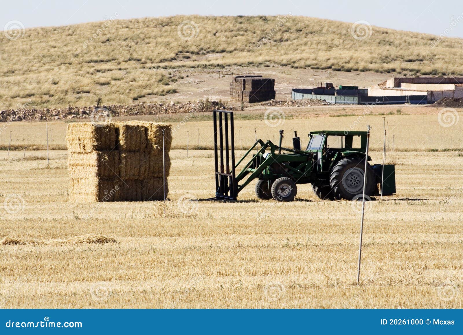 Tractor and straw packages stock photo. Image of food 20261000
