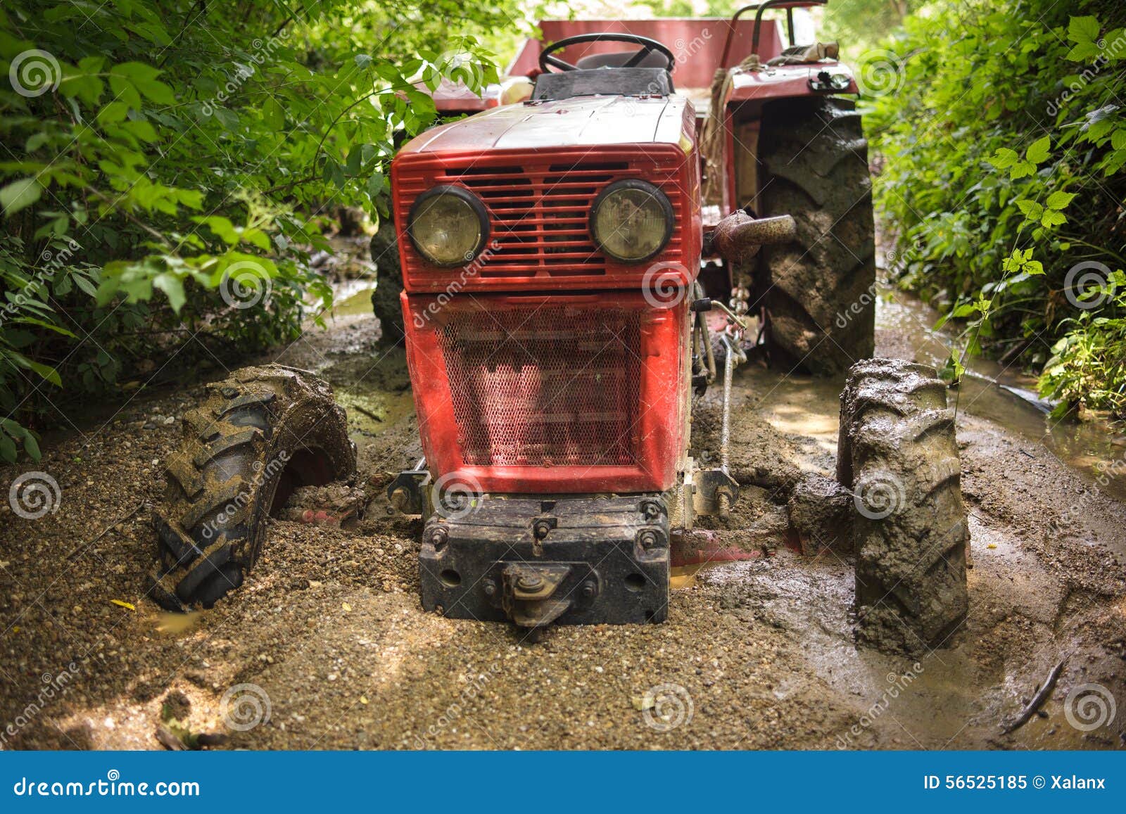 Tractor stuck in the mud stock image. Image of drowned 56525185