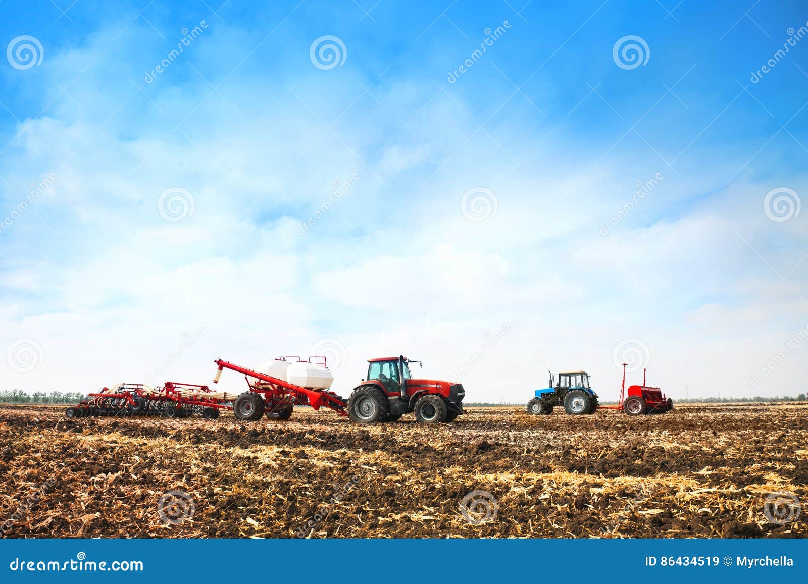 tractors with tanks in the field. agricultural machinery and farming.