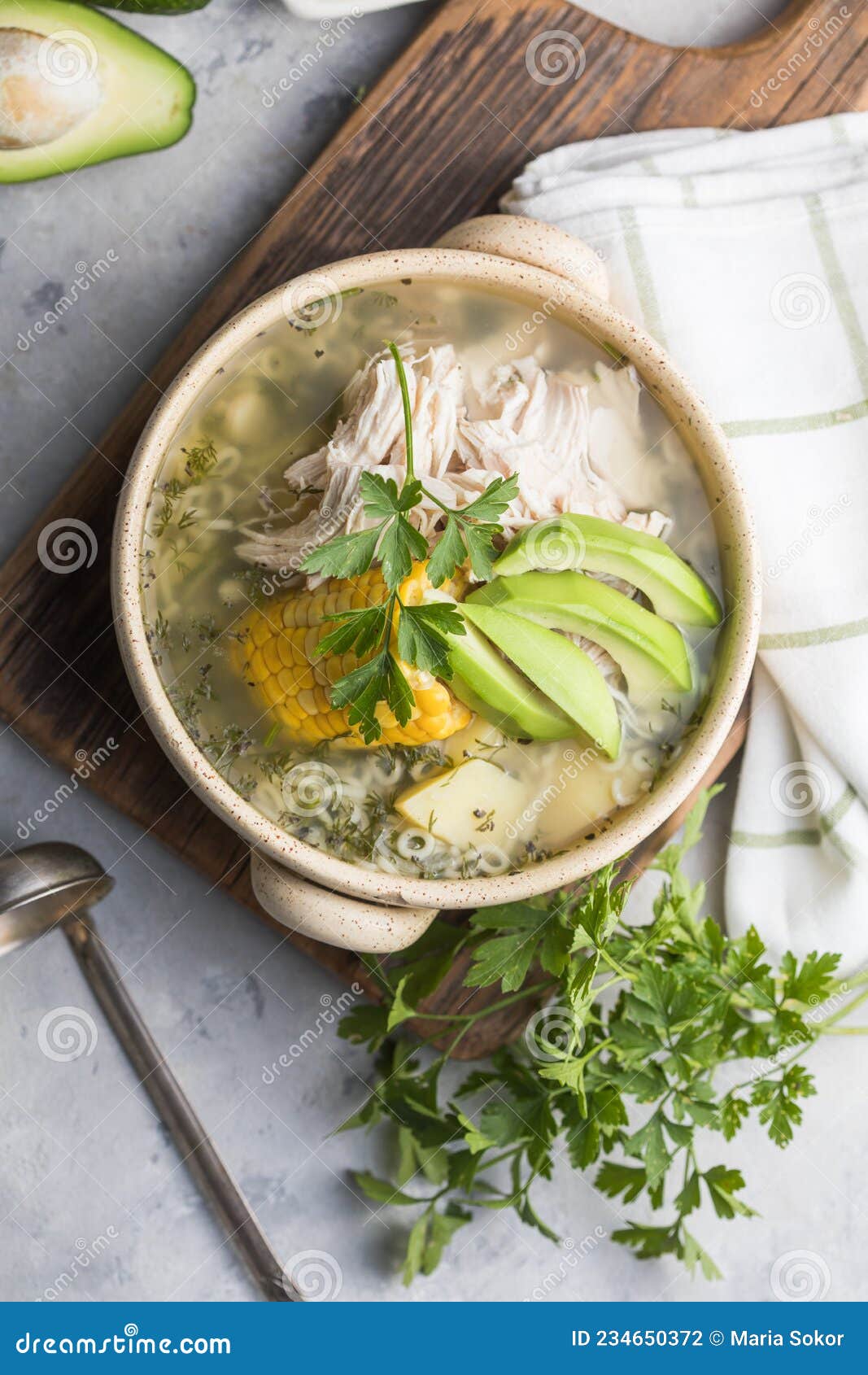 traditional ajiaco colombiano - colombian soup with potato, chicken, avocado
