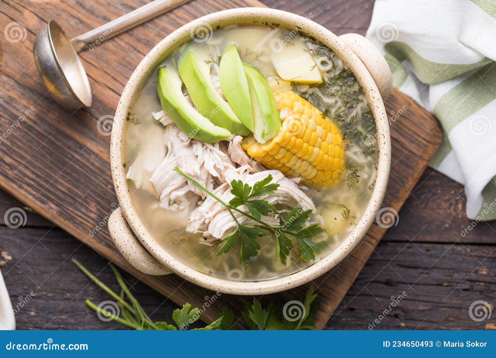 traditional ajiaco colombiano - colombian soup with potato, chicken, avocado