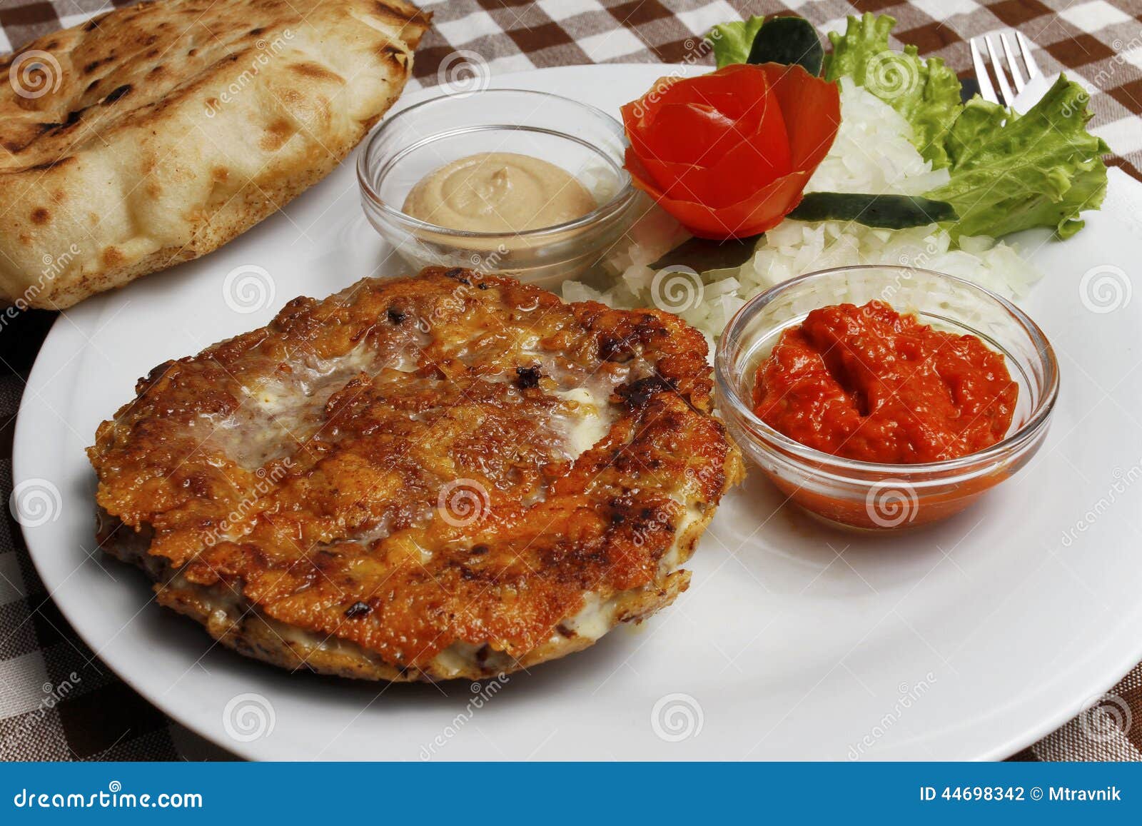 traditional balkan pljeskavica with cheese grilled meat with lepinja bread