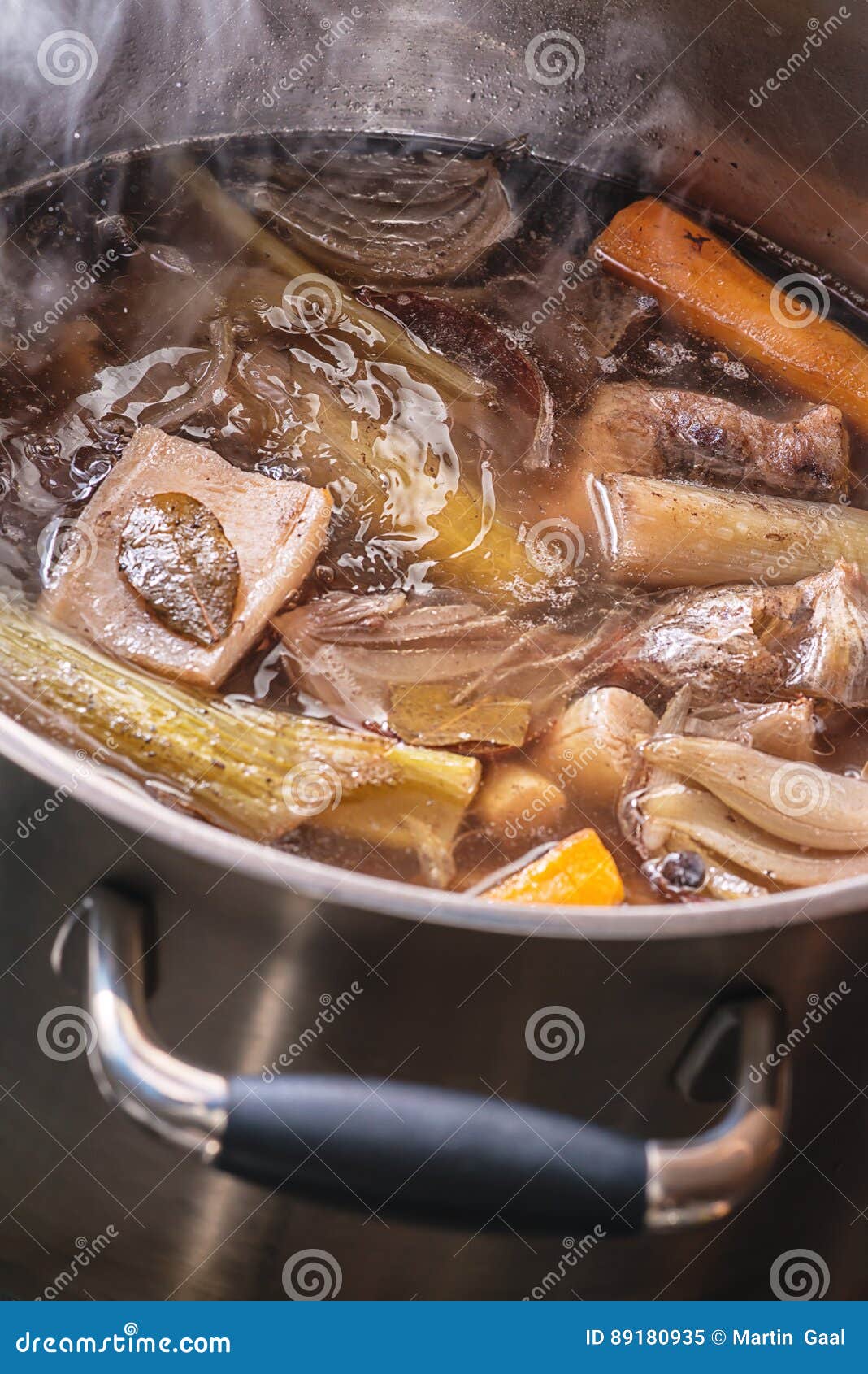 Traditional Beef Broth with Vegetable, Bones and Ingredients in Pot
