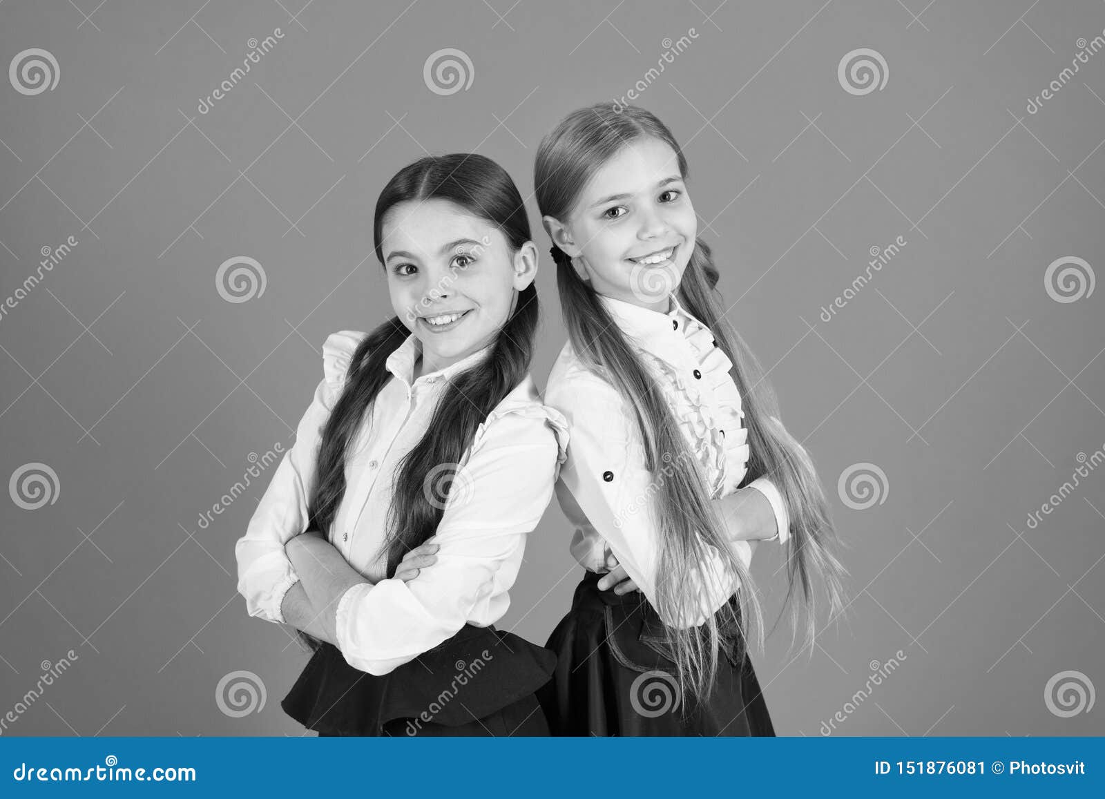 In Traditional Black and White. Little Girls Wearing School Uniform ...