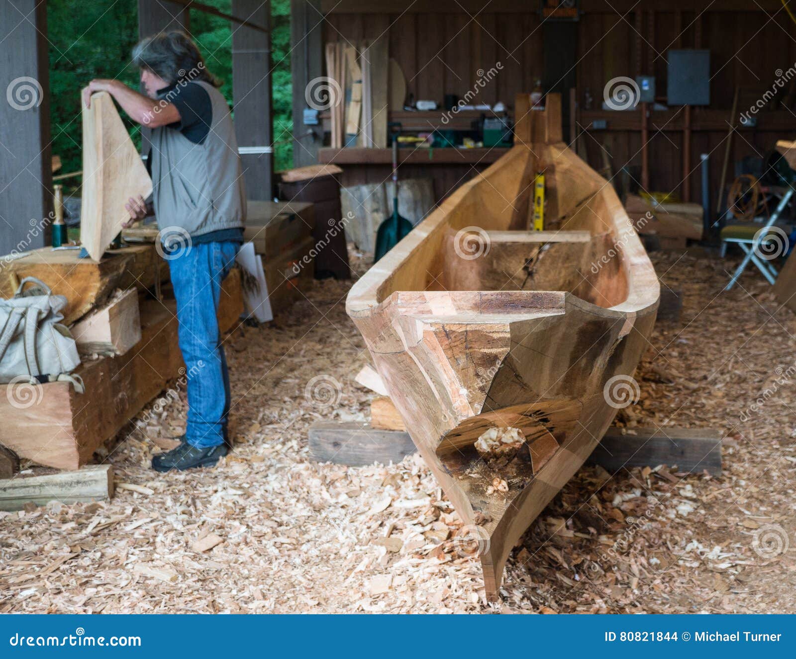 Traditional Canoe Builder editorial stock image. Image of carving 80821844