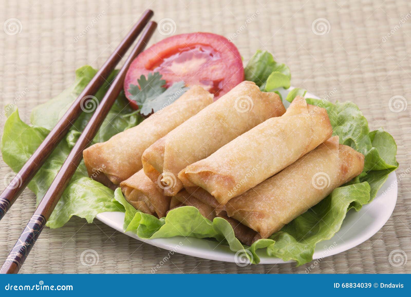 Traditional Chinese Spring Rolls on a Bed of Lettuce Stock Image