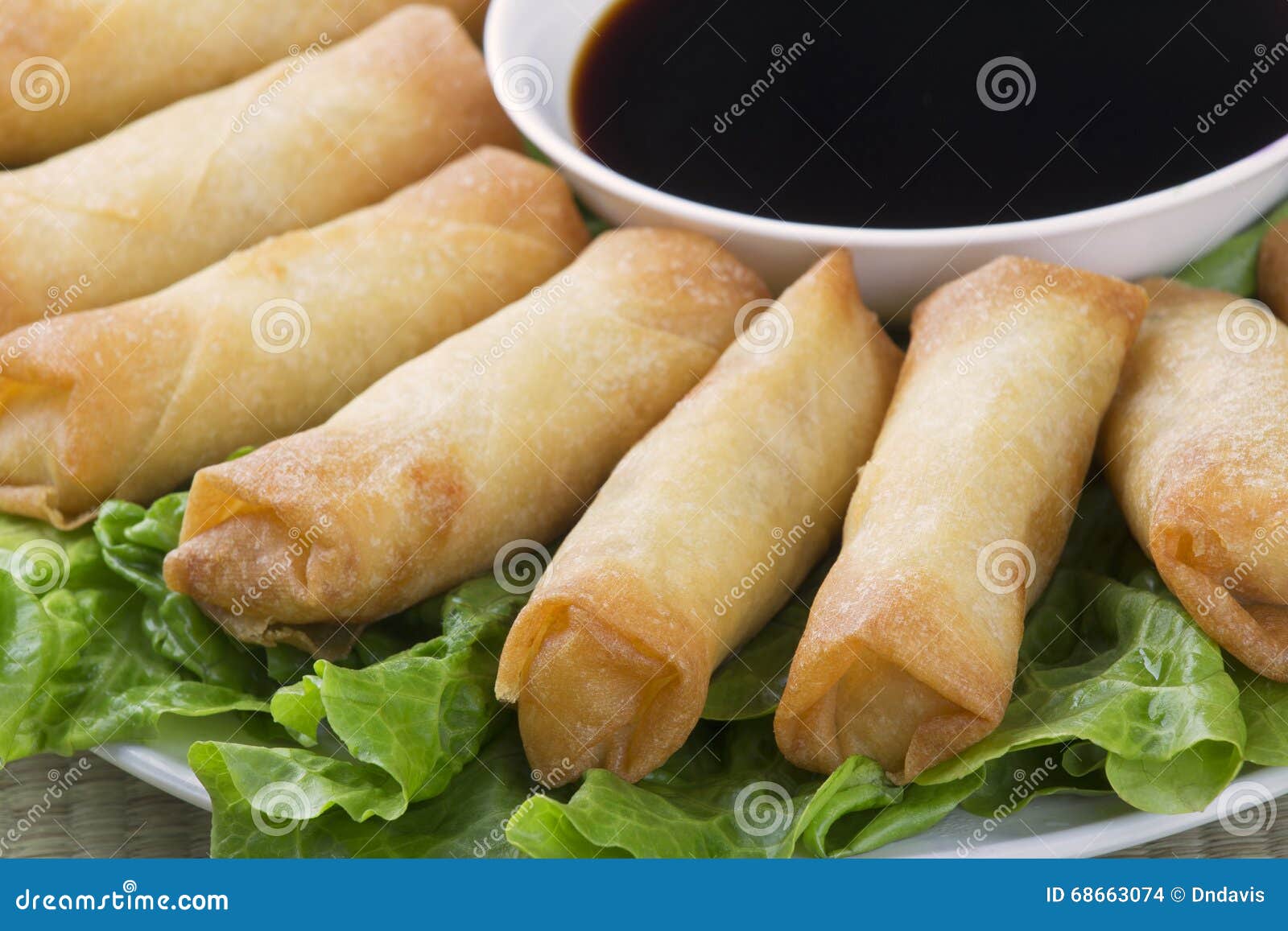 Traditional Chinese Spring Rolls with a Dipping Sause Stock Photo