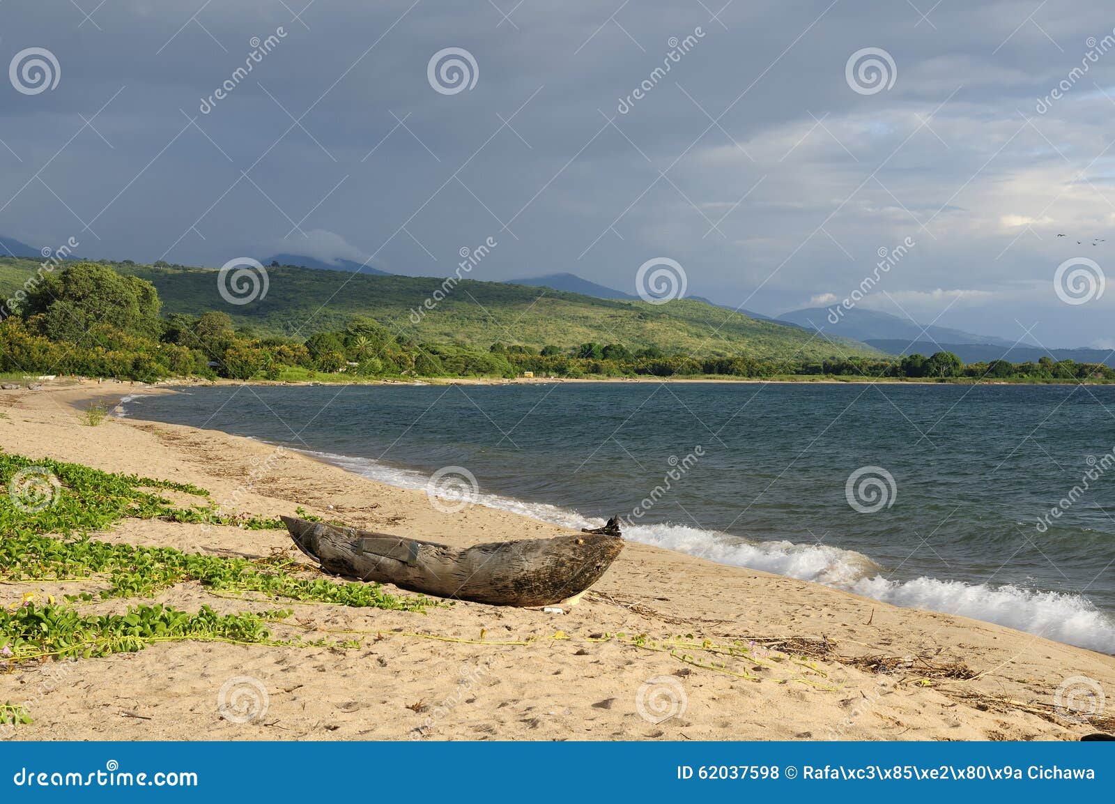 traditional dugout canoe on the beach on the lake malawi