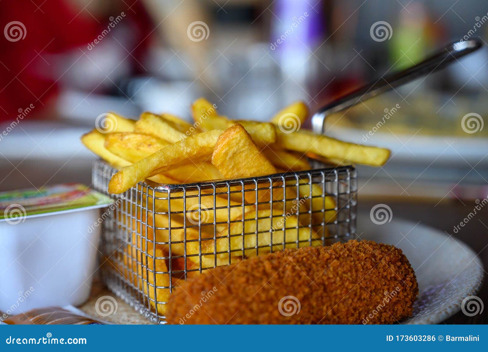 Traditional Dutch Fast Food Snacks Fricandel And French Fried Potato portion-of-french-fried-potato-chips-with-curry-and-mayonnaise-sauce