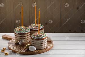 Traditional Easter Cakes With Sprinkles Candles And Decorated Eggs On 