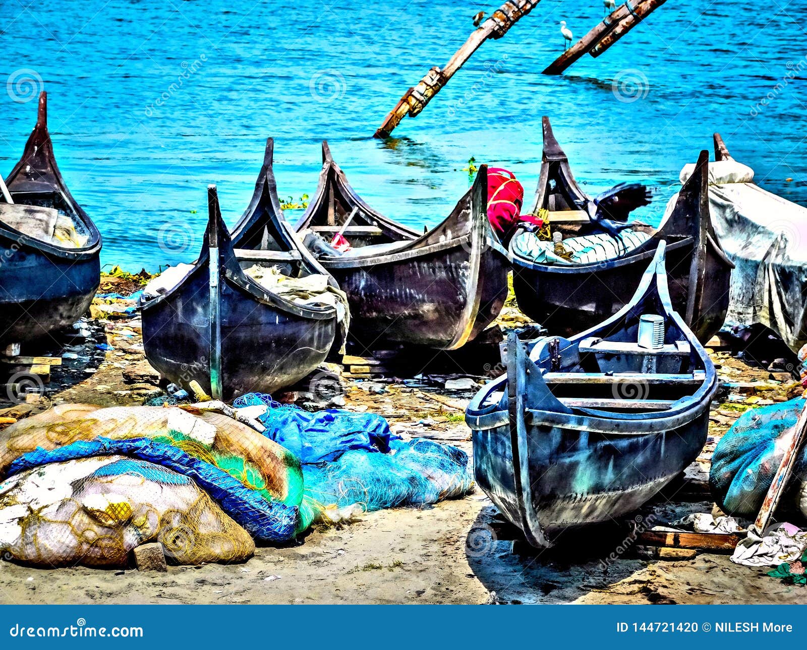 traditional fishing boats at fort cochin beach in hdr