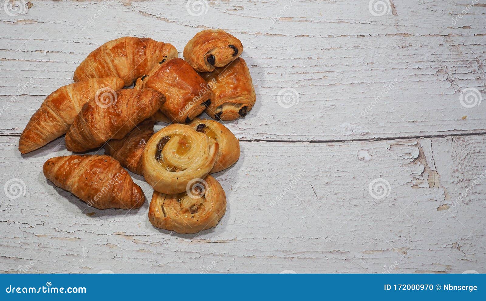 Traditional French Butter Croissant, Raisin Swirl and Chocolatine on Wooden  Background Stock Photo - Image of studio, baker: 172000970