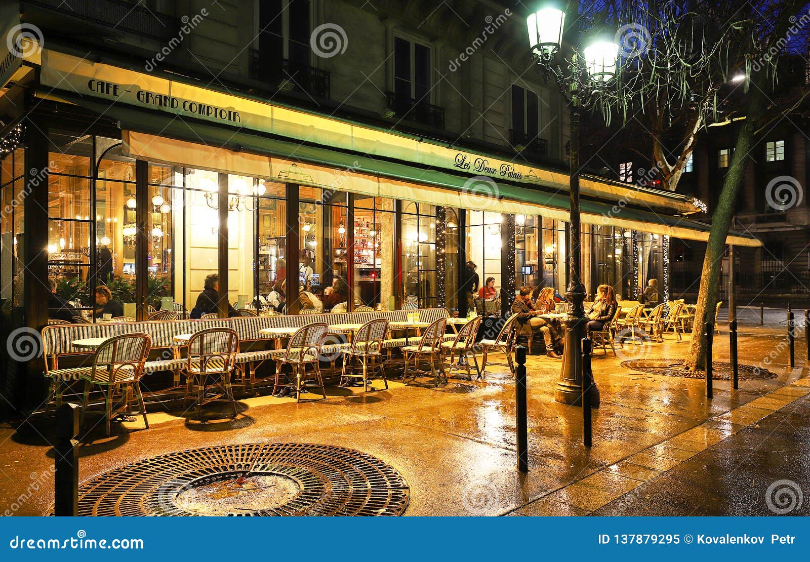 The Traditional French Cafe Deux Palais At Rainy Night It