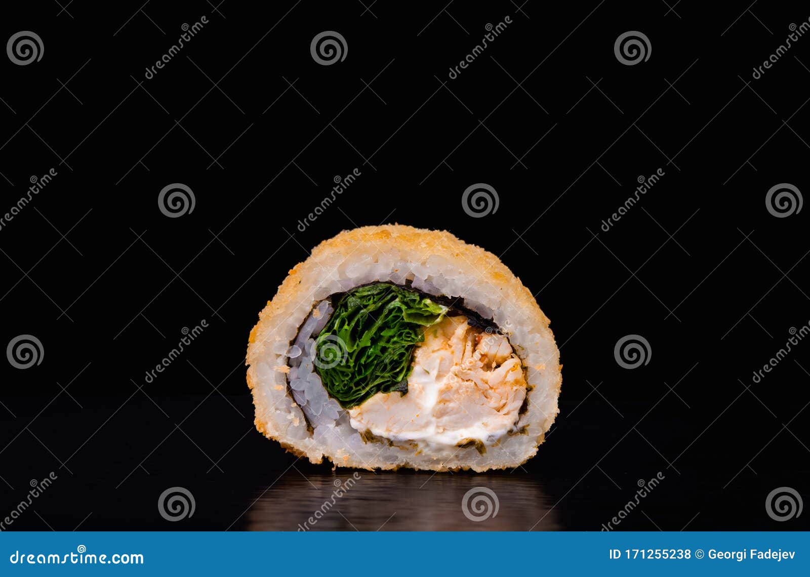 Traditional Fresh Japanese Sushi Rolls on a Black Background. Deep Fried Sushi Stock Photo