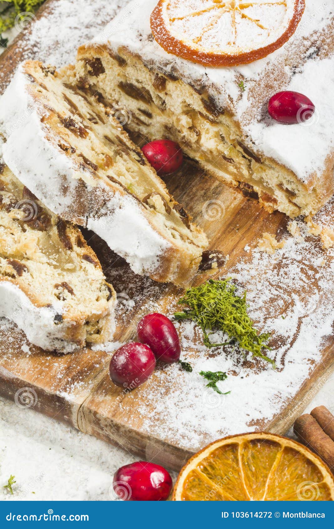 Traditional German Christmas Cake with Raisins and Marzipan. Sliced