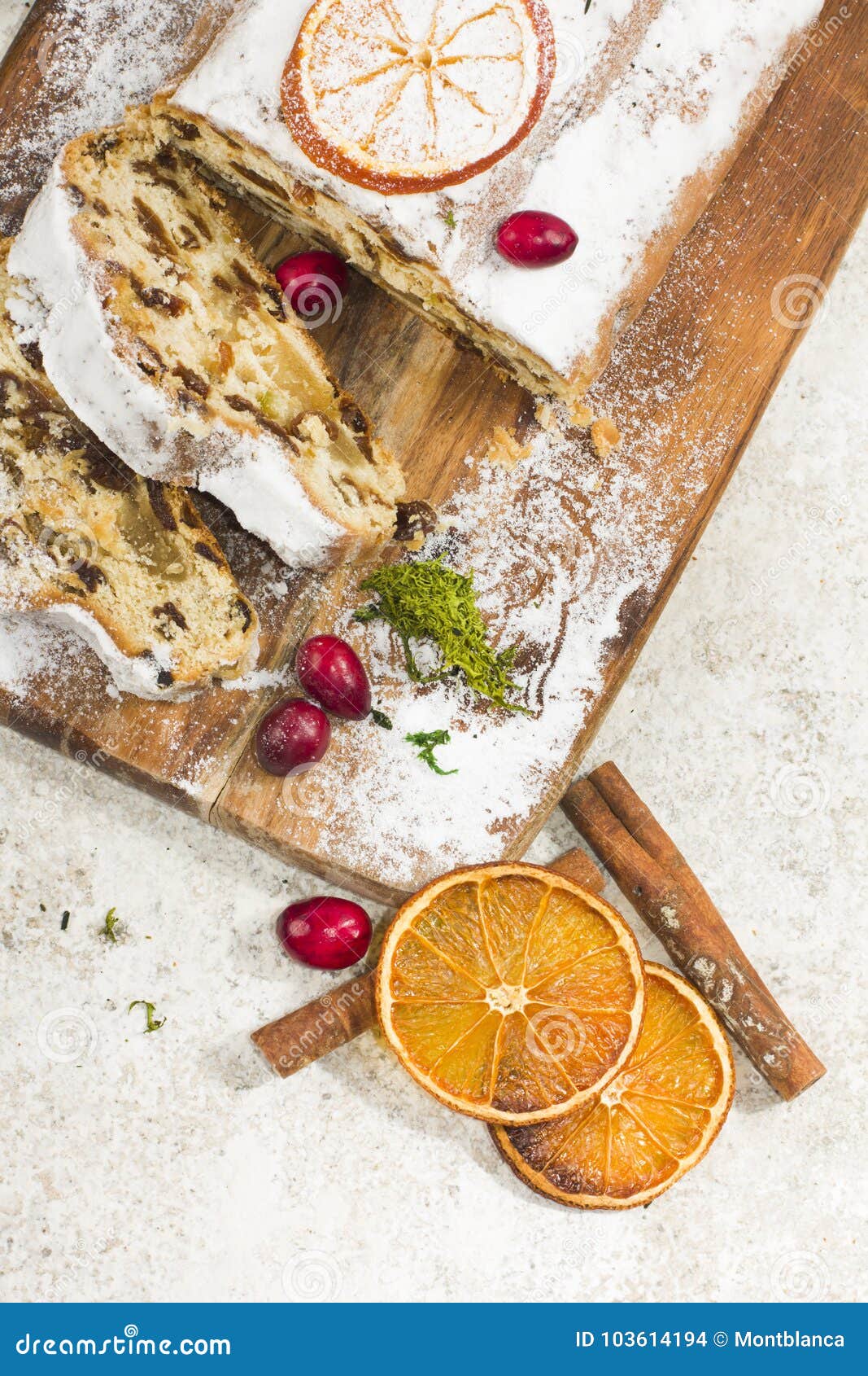 Traditional German Christmas Cake with Raisins and Marzipan. Sliced