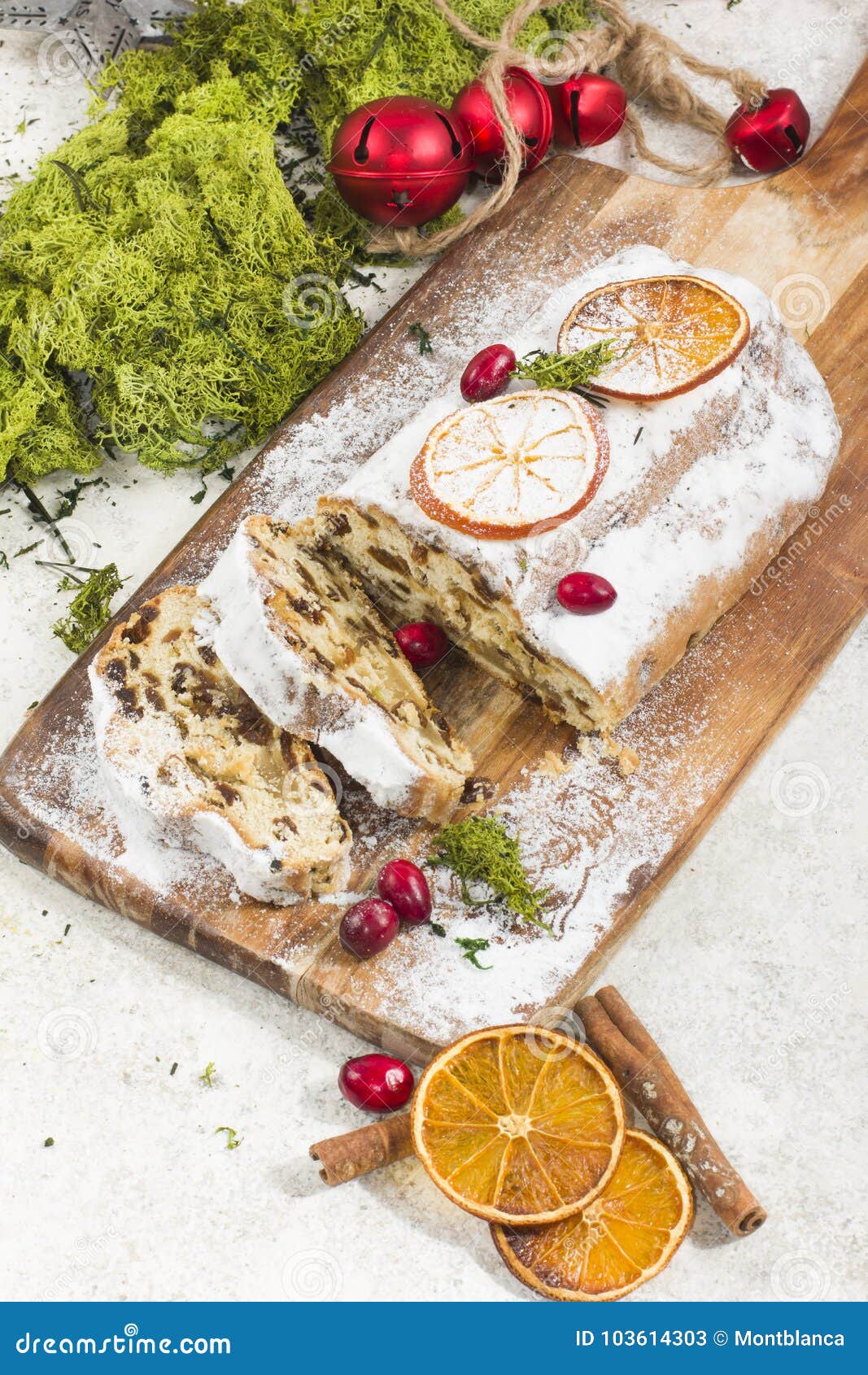 Traditional German Christmas Cake with Raisins and Marzipan. Sliced